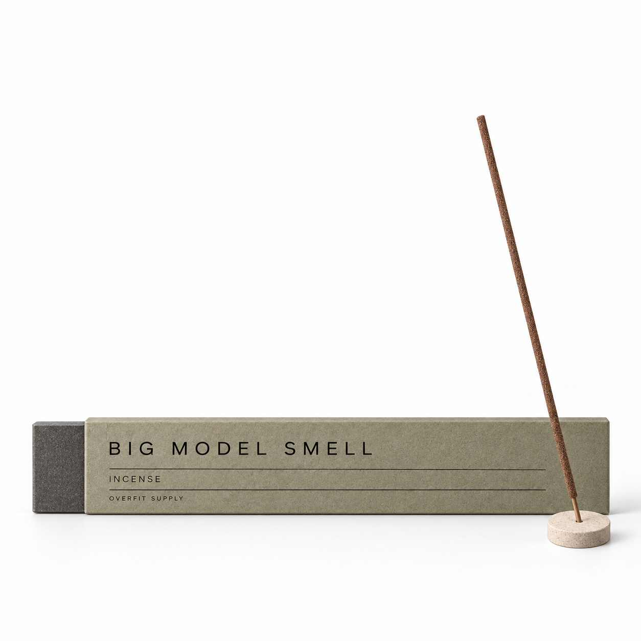 Olive-gray Big Model Smell incense sleeve with a single brown incense stick